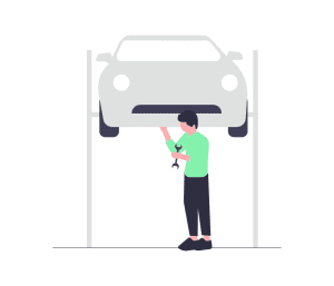 man performing car service in garage