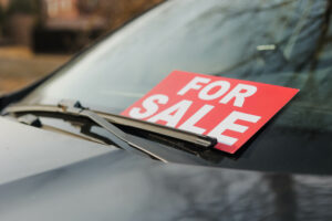 used car with for sale sign on